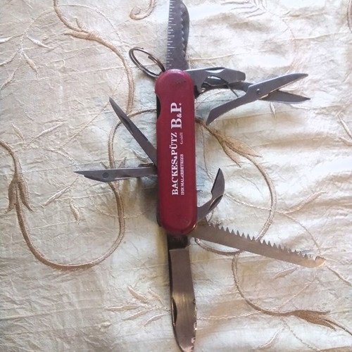 Multitool pocket knife like new, stainless steel with saw and scissors