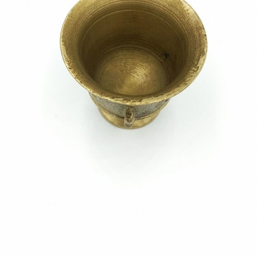 Metal mortar used with face and plant decoration