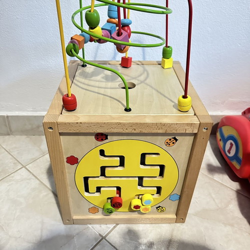 Wooden educational activity cube for children