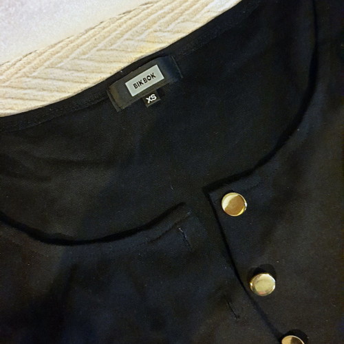 Black short jumpsuit with gold buttons and belt