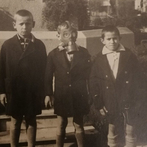 Maskoforos vintage photo with children wearing gas mask used