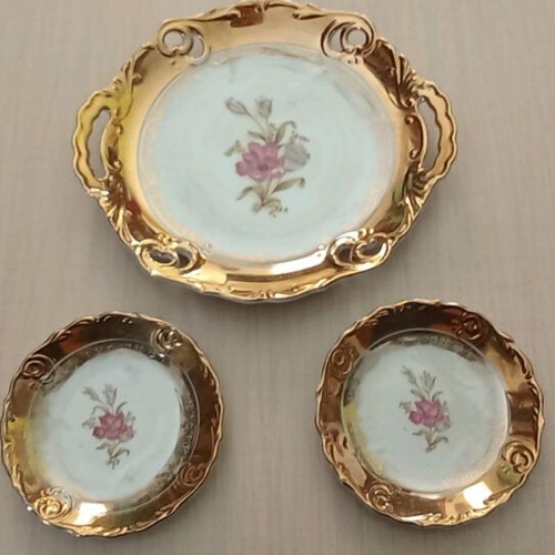 Porcelain platter and two small plates like new with gold decoration