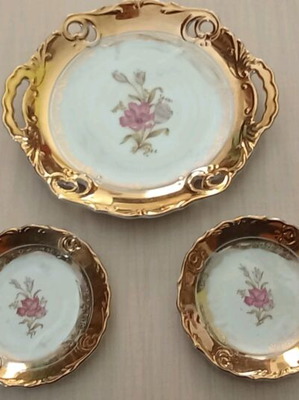 Porcelain platter and two small plates like new with gold decoration