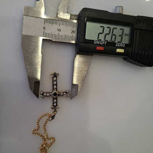 Gold cross 18K with 14K chain used with diamonds and sapphire