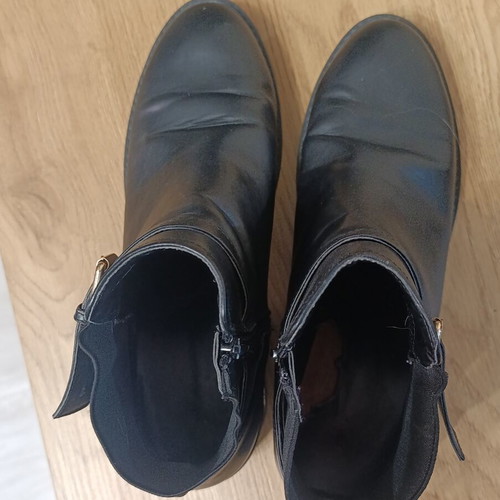 Black ankle Chelsea boots with buckle and gold details