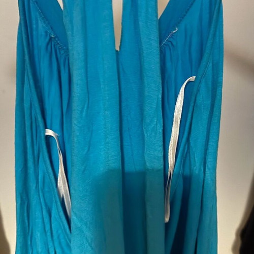 Women's sleeveless top turquoise like new, open back, elastic hem