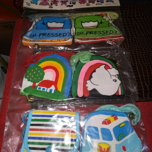Fabric wallets new with buttons, cord, and zipper
