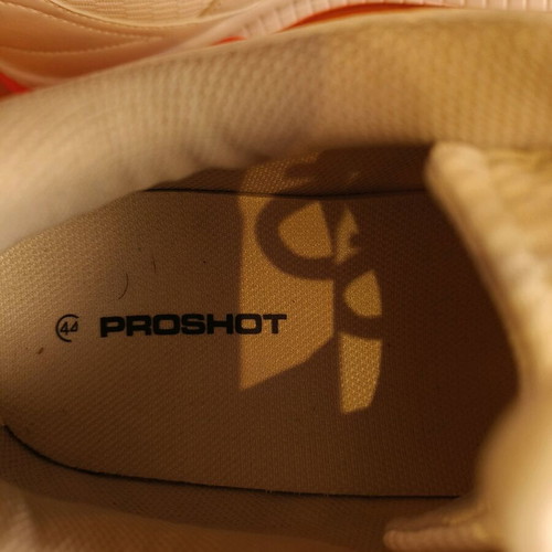 White athletic shoes like new with orange sole size 44