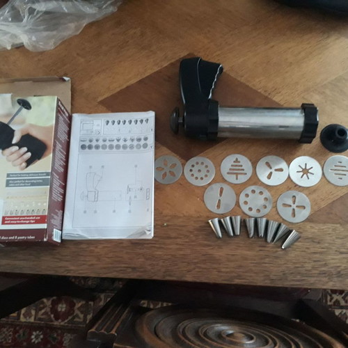 Biscuit press set used with 8 pastry nozzles and 10 dough designs