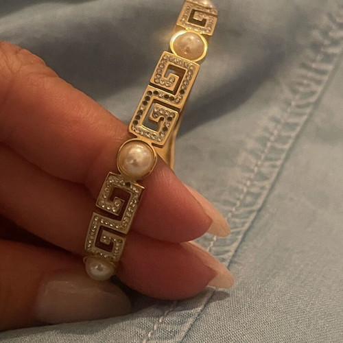 Steel bracelet used, gold color with meander design, crystals and pearls