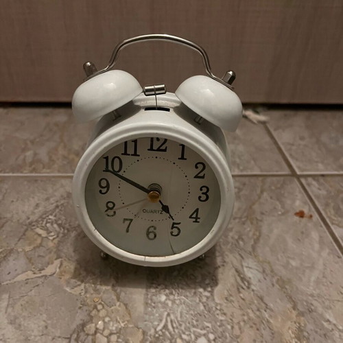 Table clock used, white with crack