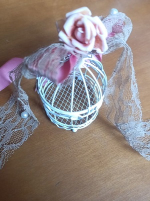 Small decorative metal birdcage used with decoration