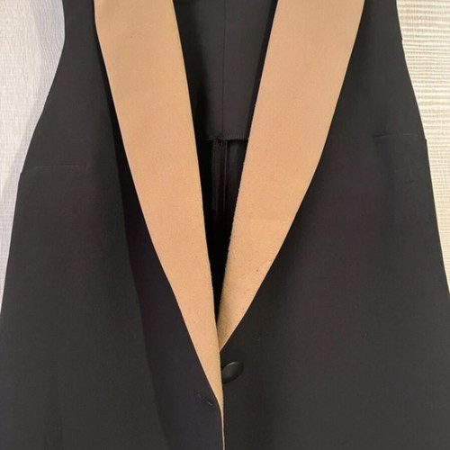 Sleeveless jacket used, black and tan, size small
