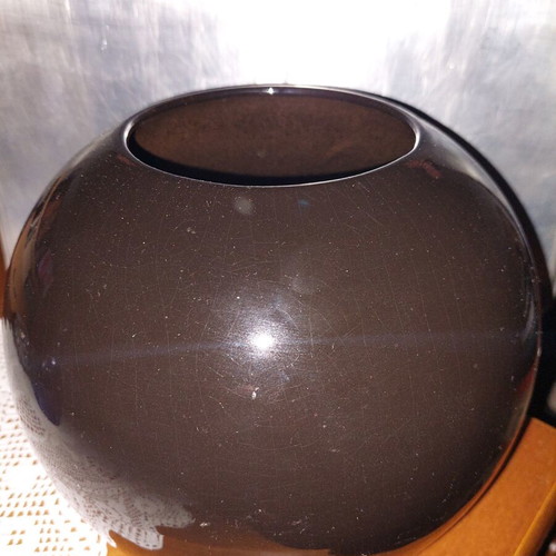 Black glass vase with plastic flowers like new