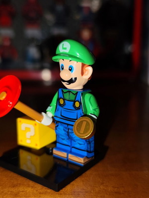 Luigi figure like new with base, question mark box, coin, suction cup