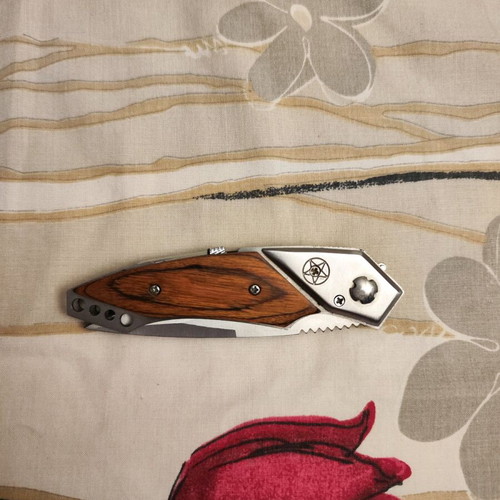 Decorative steel knife like new with button and safety lock