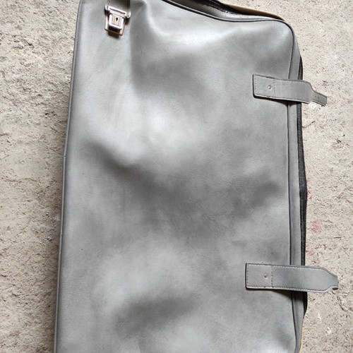 Leather suitcase old used, gray with broken zipper