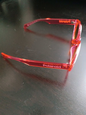Polaroid PLD 6051/G/S sunglasses like new, transparent red with orange lens