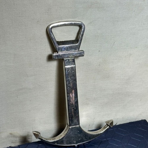 Vintage bottle opener and corkscrew anchor design used