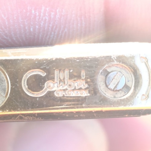 Colibri of London vintage lighter used, gold plated with black lacquer