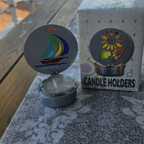 Metal candle holder with stained glass design