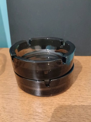 Glass black cigarette ashtrays, two, like new