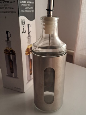 ITEM International glass oil bottle with stainless steel casing