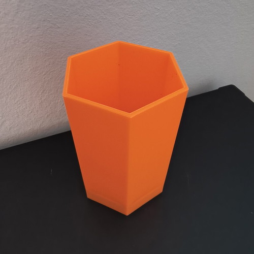 Hexagonal orange pencil holder like new, plastic