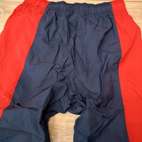 Nike track pants used, navy with red stripes