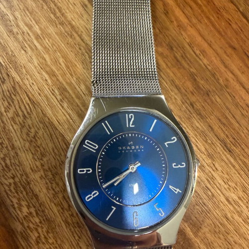 Skagen watch used with blue dial and silver bracelet