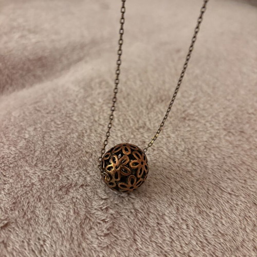 Vintage long necklace with bronze filigree floral ball pendant