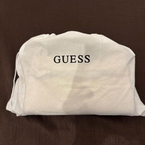 Guess white shoulder bag used with embossed logo pattern