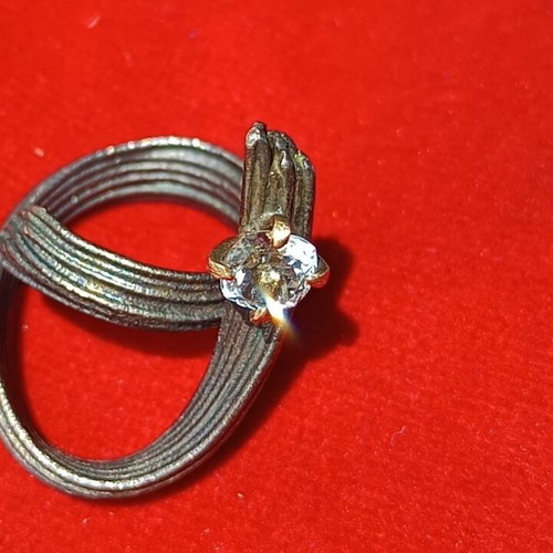 Handmade ring of oxidized silver with white topaz like new