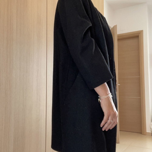 Black coat used with wool by Carling