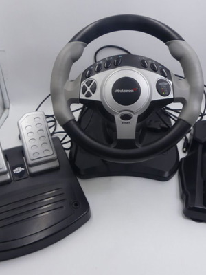 PlayStation McLaren steering wheel used with pedals and gear shifter