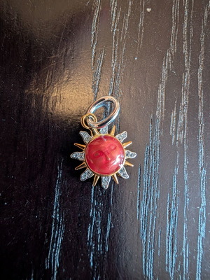 Red sun charm with embossed face, gold details, S925