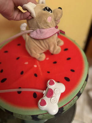 Plush dog with pink wired controller