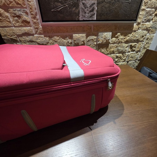 Carpisa 24" travel suitcase used, magenta color, semi-hard fabric