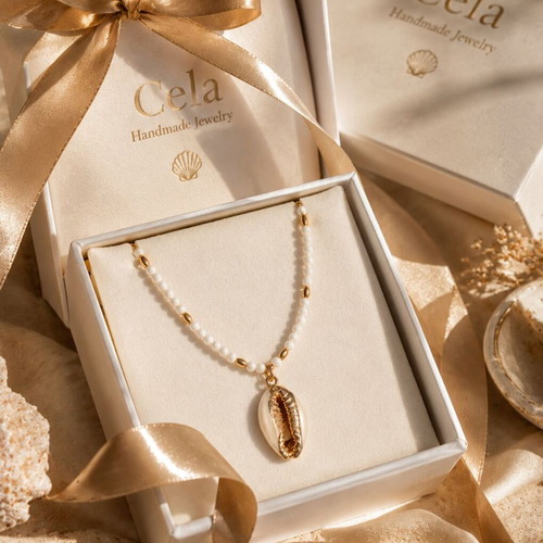 Handmade necklace with white semiprecious stone and natural shell with gold accents