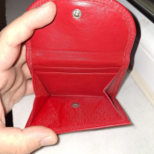 Small red wallet with coin and bill compartments