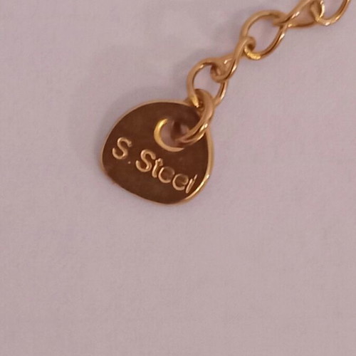 Bella stainless steel necklace with gold-tone heart and angel wings pendant