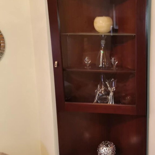 Corner crystal cabinet like new, solid wood with glass and wooden shelves