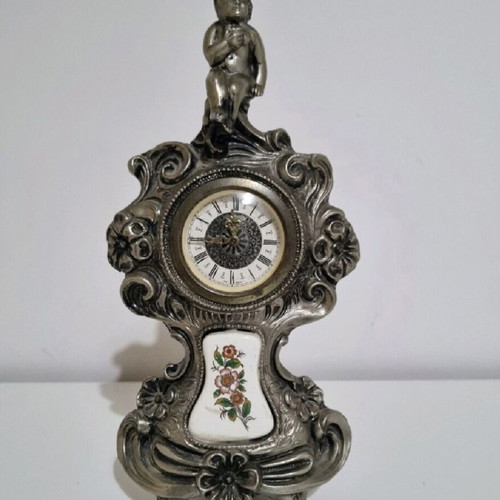Antique clock used with German mechanism and porcelain decoration