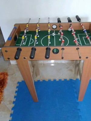 Foosball table used with 6 rows of players and score board