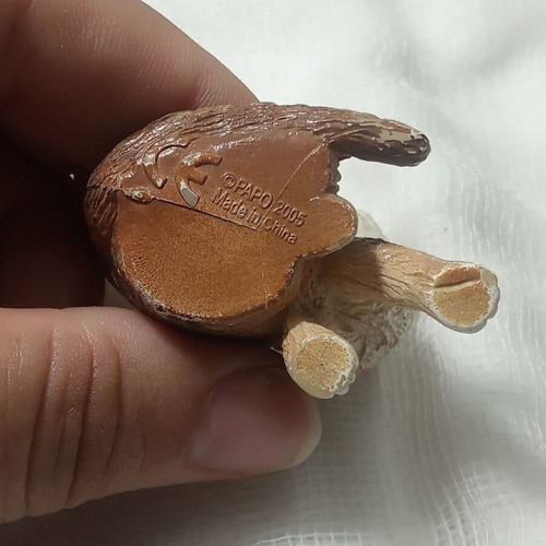Cat miniature with realistic brown and white fur