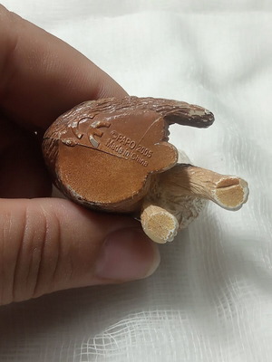 Cat miniature with realistic brown and white fur