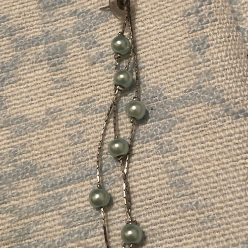 Dangling earrings with sea blue beads used