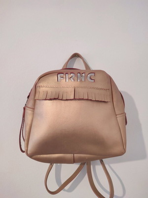 FRNC gold backpack bag like new