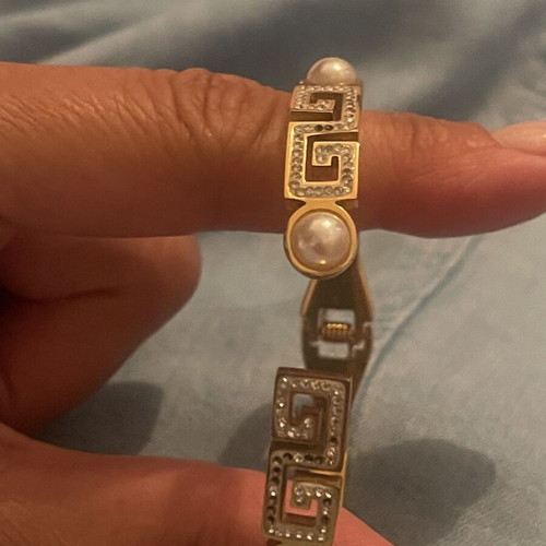 Steel bracelet used, gold color with meander design, crystals and pearls