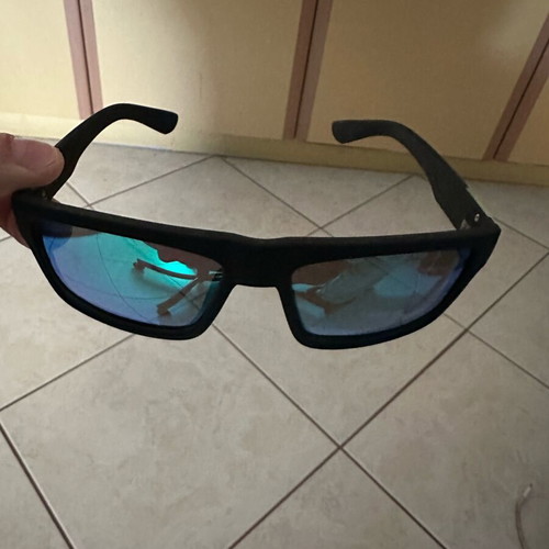 Polarized sunglasses new with green lens and black frame